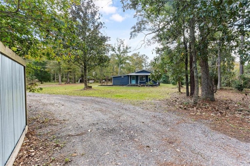 Welcome to this unique, secluded cottage nestled on 7.5 private - Beach Home for sale in Mobile, Alabama on Beachhouse.com