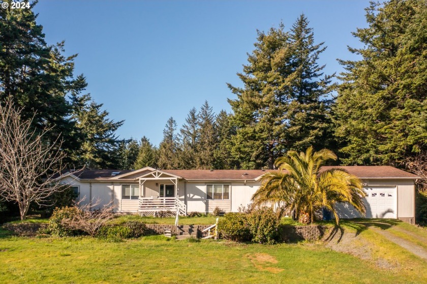 Situated on just over 3/4 of an acre, this sunlit south-facing - Beach Home for sale in Langlois, Oregon on Beachhouse.com