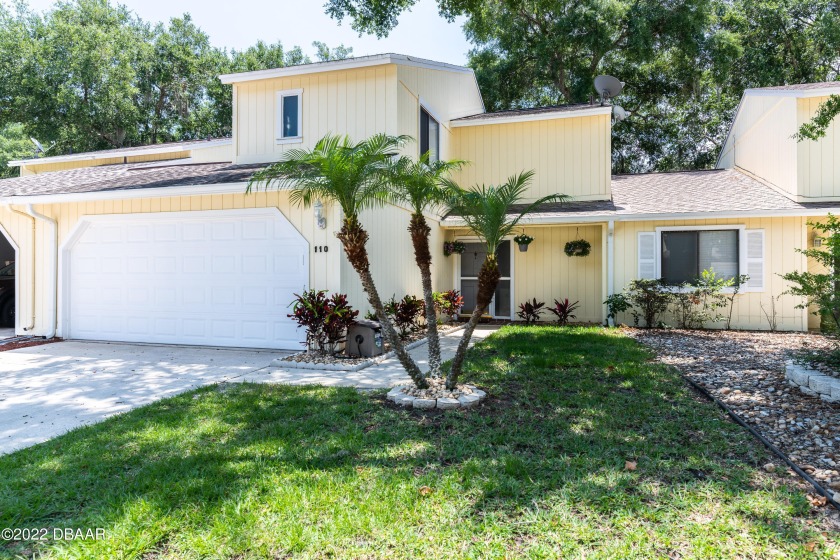 This two-story town home is nestled among the mature trees of - Beach Home for sale in Ormond Beach, Florida on Beachhouse.com