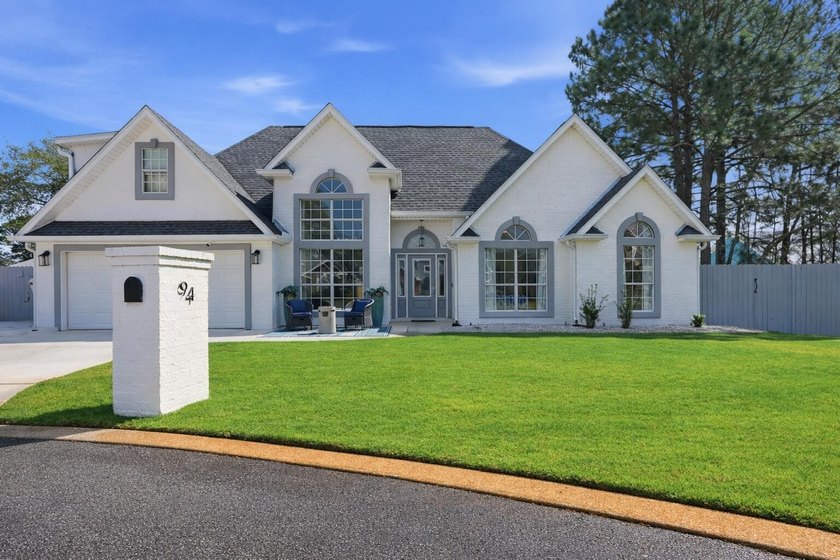 Tucked away on a quiet cul-de-sac beside a peaceful pond, this - Beach Home for sale in Miramar Beach, Florida on Beachhouse.com