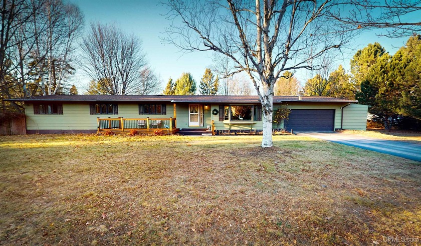 Welcome to 201 Cedar Ln., a charming ranch-style home perfectly - Beach Home for sale in Marquette, Michigan on Beachhouse.com
