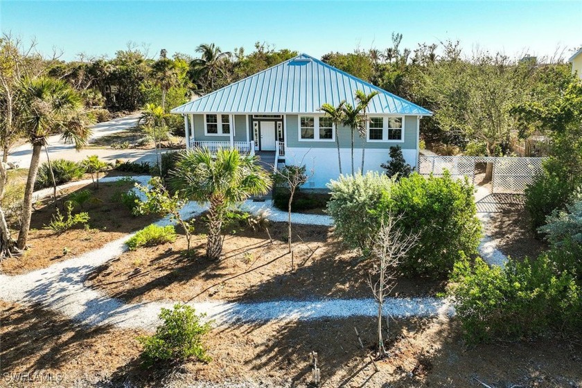 Are you ready to move up??? This elevated, thoughtfully updated - Beach Home for sale in Sanibel, Florida on Beachhouse.com