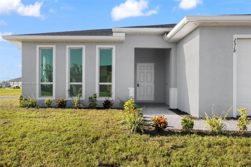 This 4-bedroom, 2-bathroom home, newly built in 2023, offers a - Beach Home for sale in Cape Coral, Florida on Beachhouse.com
