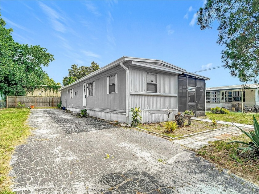 Charming 3-Bedroom Mobile Home on Oversized Lot - NO HOA, NO - Beach Home for sale in New Port Richey, Florida on Beachhouse.com