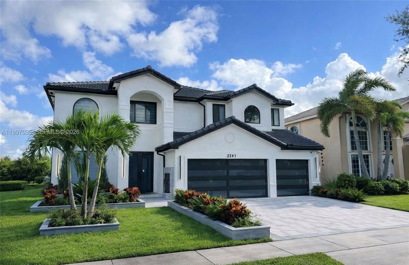 A statement in modern architecture, this stunning Miramar Estate - Beach Home for sale in Miramar, Florida on Beachhouse.com