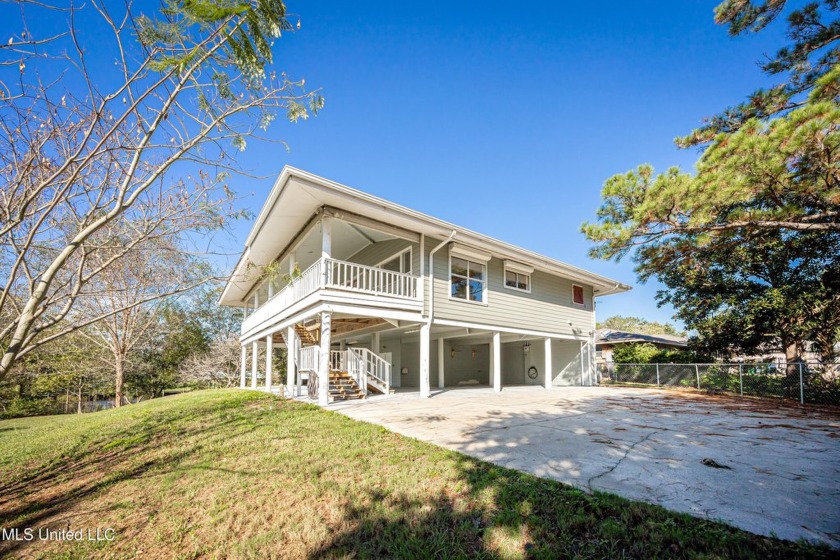 Your Waterfront Dream Awaits! Nestled on a serene deep-water - Beach Home for sale in Ocean Springs, Mississippi on Beachhouse.com