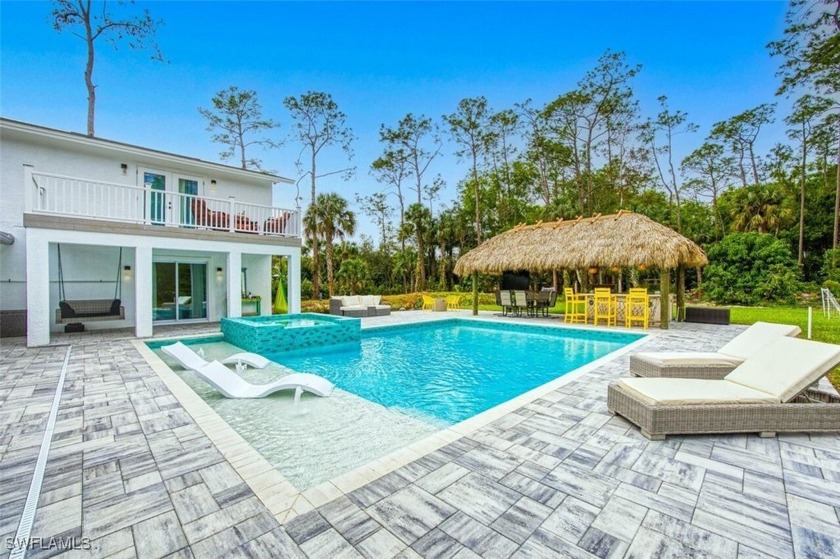 Welcome to this beautifully upgraded single-family home set on 2 - Beach Home for sale in Naples, Florida on Beachhouse.com