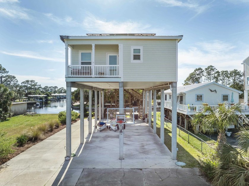 Imagine a serene coastal property nestled on a deepwater canal - Beach Home for sale in Crawfordville, Florida on Beachhouse.com