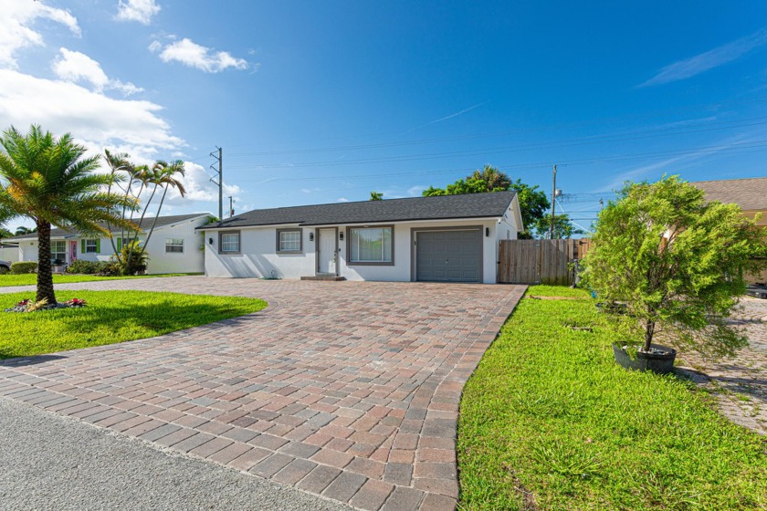 Welcome to this beautifully remodeled home, updated in 2023 to - Beach Home for sale in West Palm Beach, Florida on Beachhouse.com