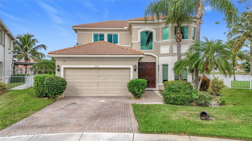 Welcome to this stunning two-story home located in one of the - Beach Home for sale in Pembroke Pines, Florida on Beachhouse.com