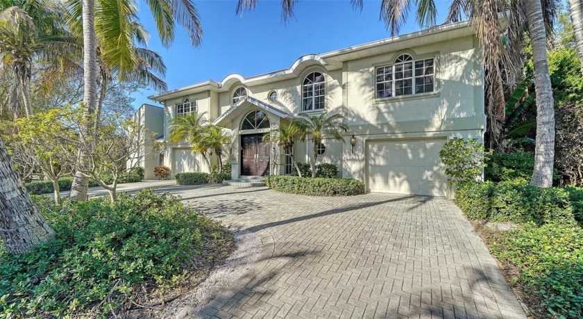 $200,000 PRICE REDUCTION! This elevated canal front home on - Beach Home for sale in Longboat Key, Florida on Beachhouse.com