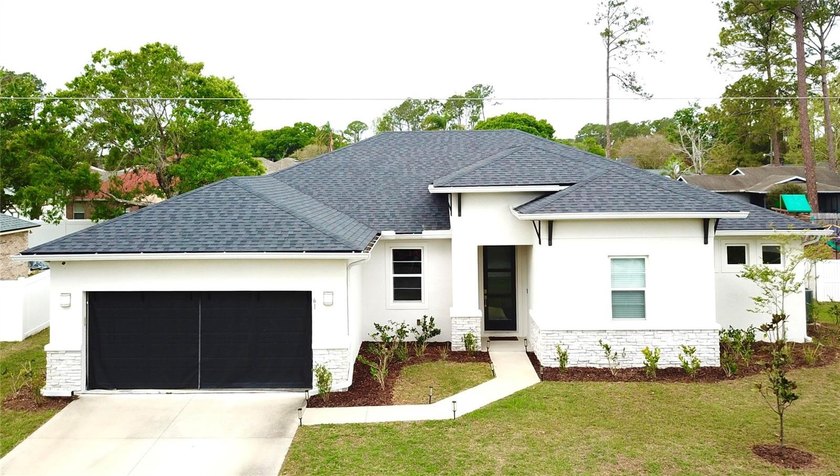 This beautifully designed, modern, energy-efficient home - Beach Home for sale in Palm Coast, Florida on Beachhouse.com