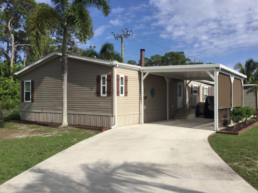 Beautifully updated home which backs to canal and greenbelt - Beach Home for sale in Port Saint Lucie, Florida on Beachhouse.com