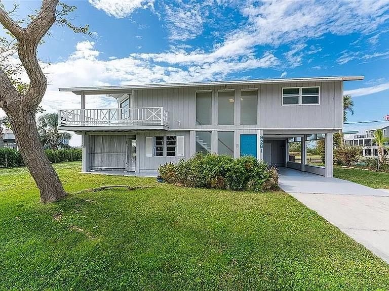 This beautifully situated canal and intracoastal view, two - Beach Home for sale in Englewood, Florida on Beachhouse.com