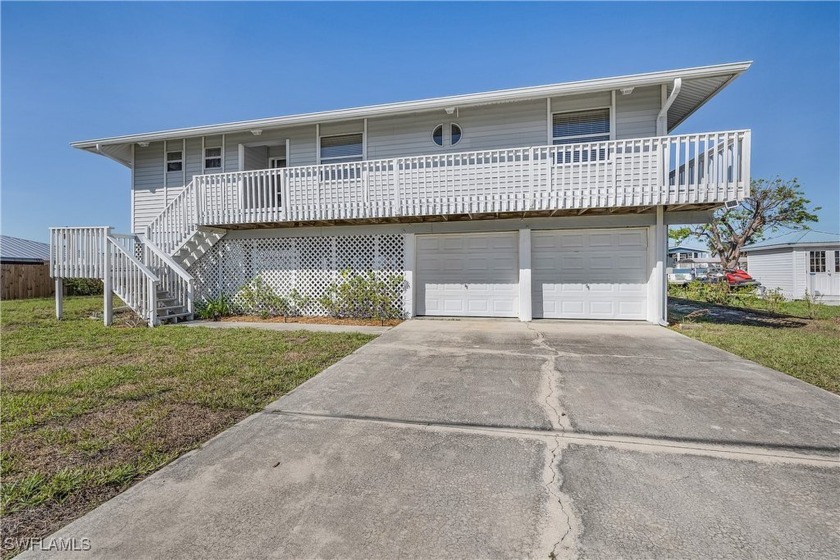 Impecably maintained TURNKEY piling home on direct access canal - Beach Home for sale in St. James City, Florida on Beachhouse.com