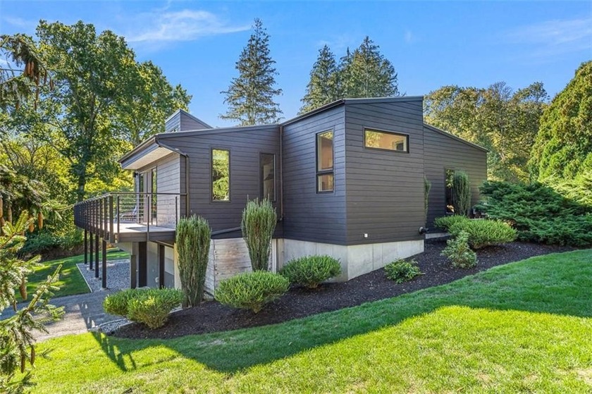 Step into mid-century modern elegance with this 1971 Ira - Beach Home for sale in Jamestown, Rhode Island on Beachhouse.com