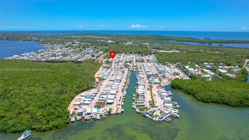 BEST BUY OF ALL in boater's paradise, fabulous Calusa Campground - Beach Condo for sale in Key Largo, Florida on Beachhouse.com