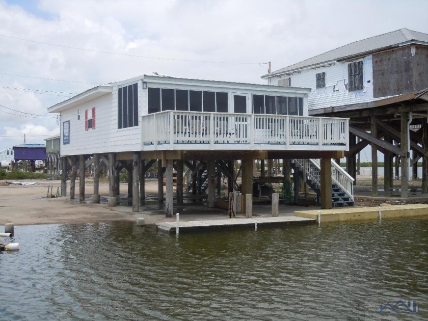 This quaint 2 bedroom, bath and a half waterfront cottage is - Beach Home for sale in Grand Isle, Louisiana on Beachhouse.com
