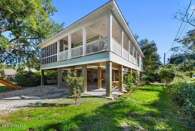 Nestled just a golf cart ride away from the Bay/Waveland Yacht - Beach Home for sale in Bay Saint Louis, Mississippi on Beachhouse.com