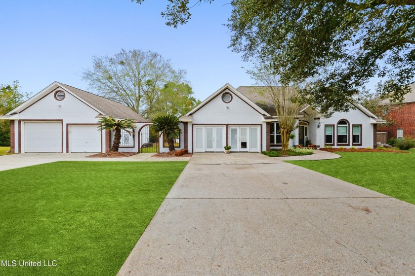 Waterfront home in Windance Golf Community is situated on a - Beach Home for sale in Gulfport, Mississippi on Beachhouse.com