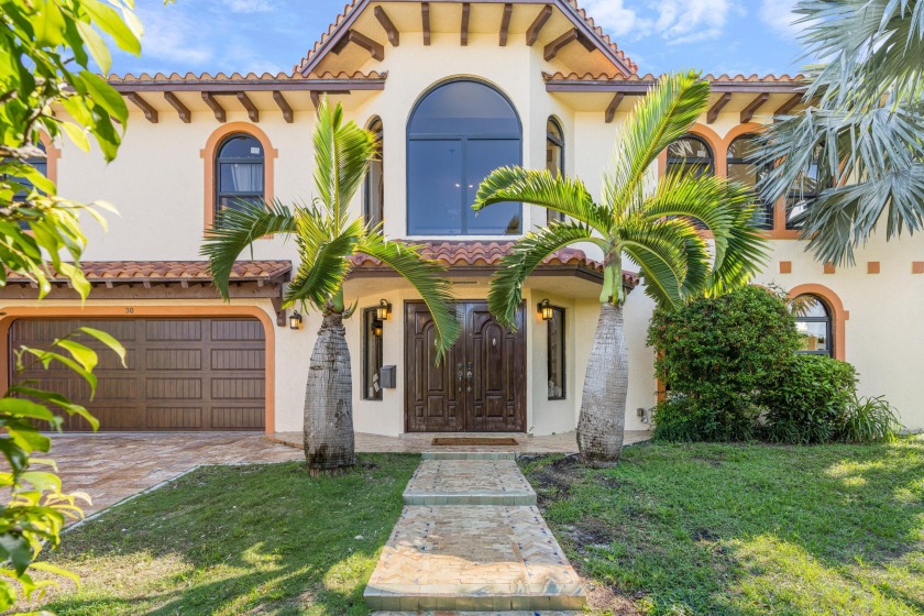 Make this grand home your very own paradise. This spacious and - Beach Home for sale in Lake Worth Beach, Florida on Beachhouse.com