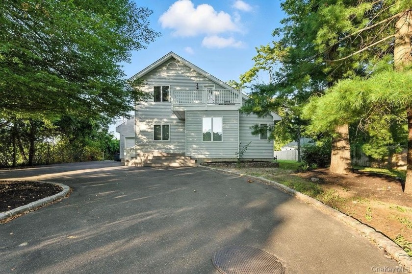 Welcome home to this secluded and bright home nestled next to a - Beach Home for sale in Jamesport, New York on Beachhouse.com