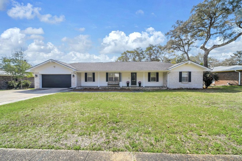 Discover this charming 4-bed, 2-bath home on nearly 1/2 acre in - Beach Home for sale in Fort Walton Beach, Florida on Beachhouse.com