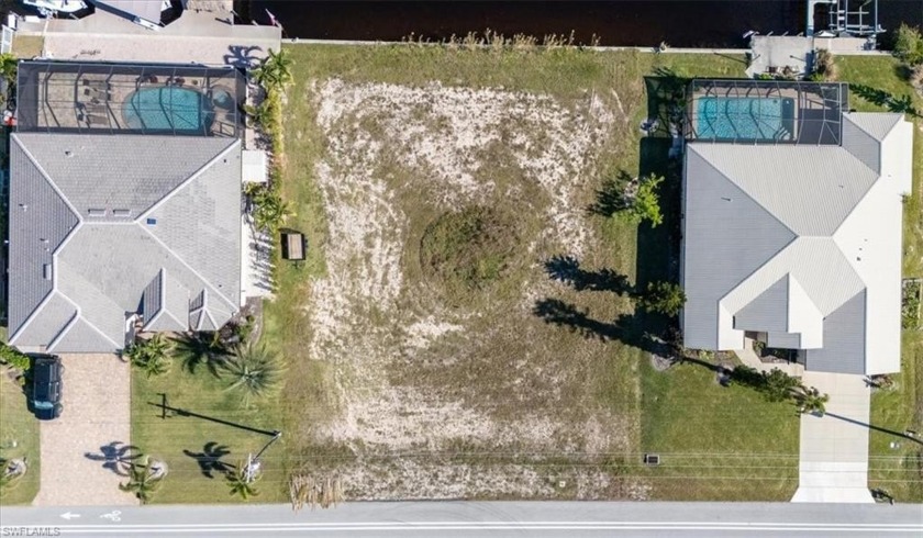 Nestled along the picturesque Webb Canal, this oversized - Beach Lot for sale in Cape Coral, Florida on Beachhouse.com