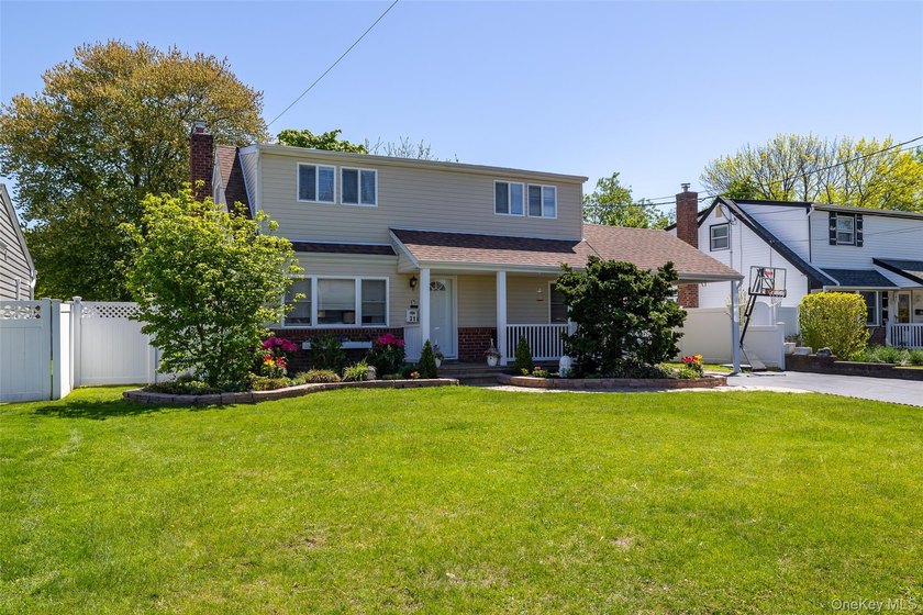 Welcome to this beautifully maintained and expanded cape nestled - Beach Home for sale in North Babylon, New York on Beachhouse.com