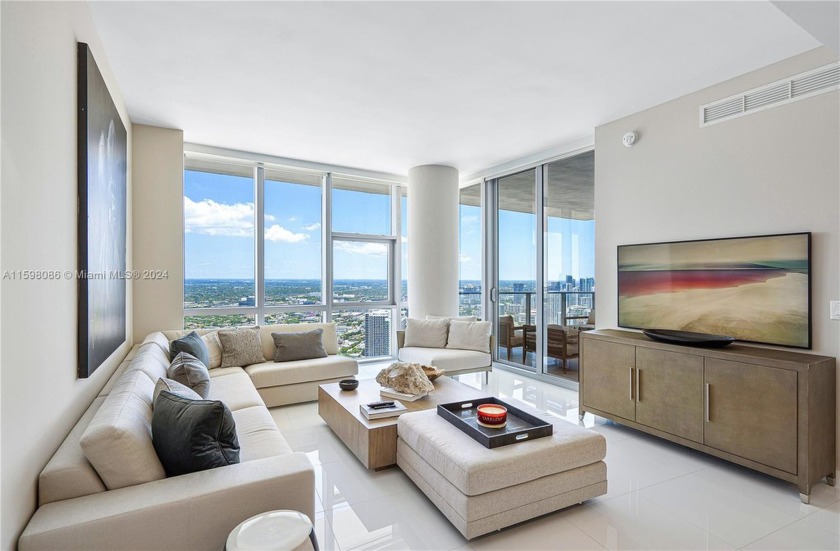 Welcome to this furnished 3-bedroom + den, 4 bathroom modern - Beach Condo for sale in Miami, Florida on Beachhouse.com