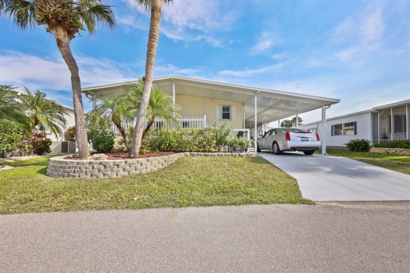 The inviting front porch on this 2005 Palm Harbor is the perfect - Beach Home for sale in Port Charlotte, Florida on Beachhouse.com