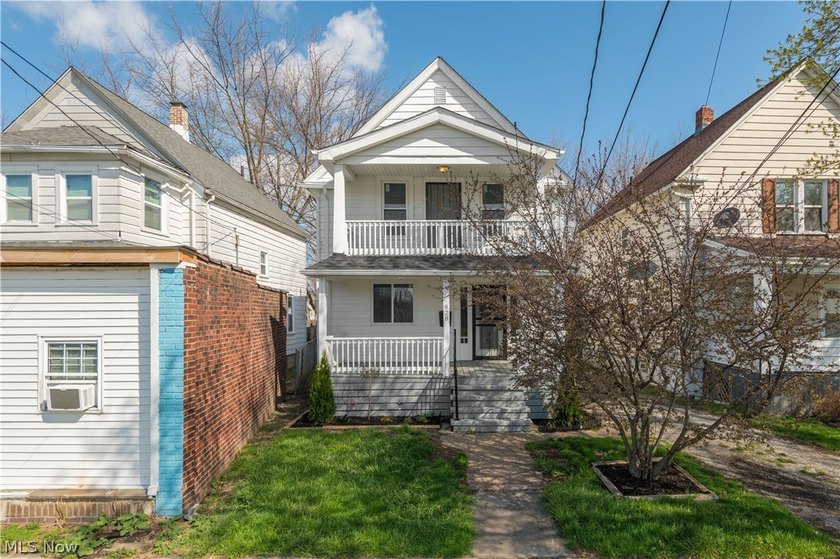 Charming two-story home featuring beautiful double front porches - Beach Home for sale in Lorain, Ohio on Beachhouse.com