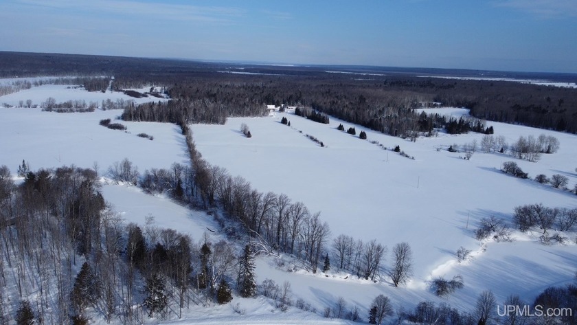 Discover a rare opportunity to own prime vacant land with - Beach Acreage for sale in Baraga, Michigan on Beachhouse.com