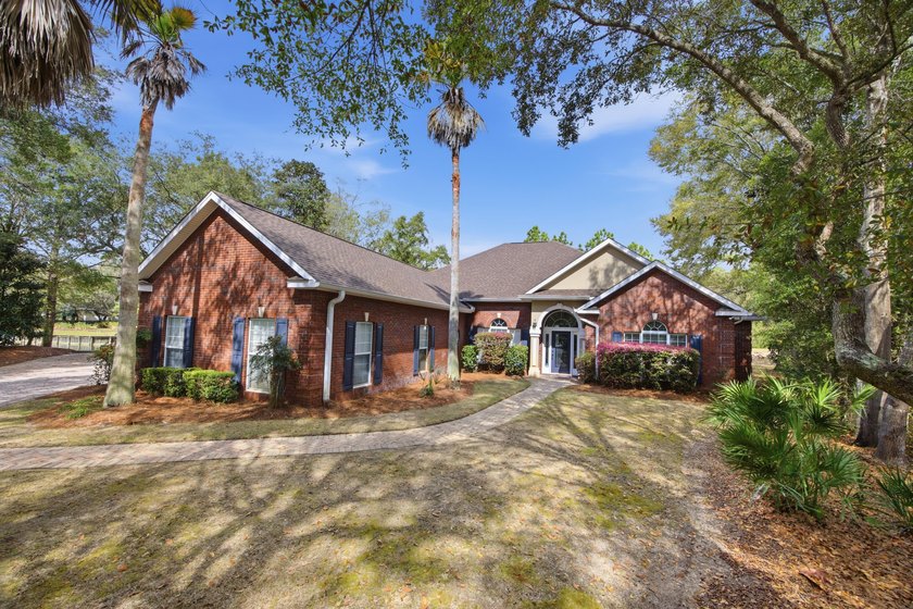 Beautiful CUSTOM built brick home, situated lakefront on a quiet - Beach Home for sale in Niceville, Florida on Beachhouse.com