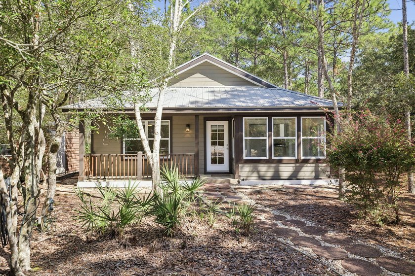 Tucked beneath a canopy of towering oaks and pines on a rare 0 - Beach Home for sale in Santa Rosa Beach, Florida on Beachhouse.com