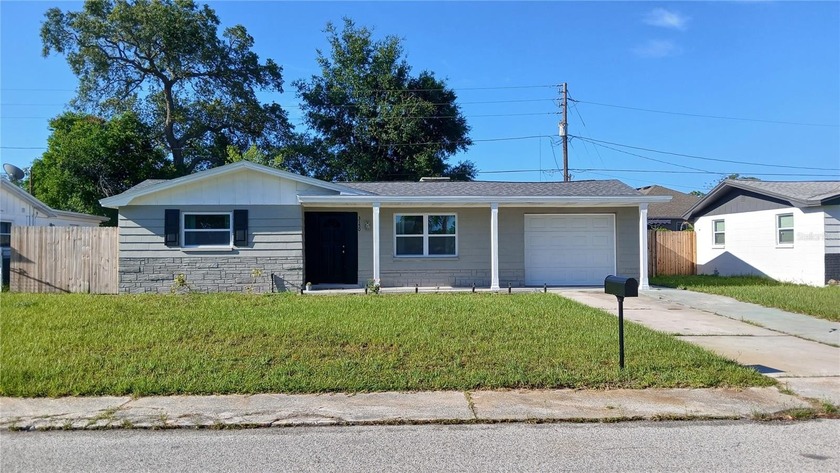Move-in ready and completely renovated, this beautifully updated - Beach Home for sale in Holiday, Florida on Beachhouse.com