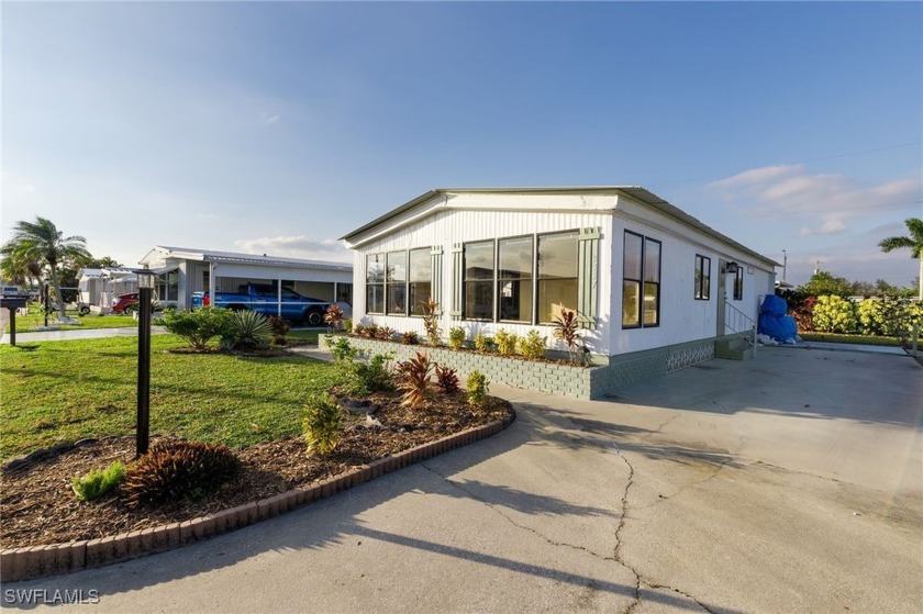 Welcome to this remodeled corner lot home, where modern updates - Beach Home for sale in North Fort Myers, Florida on Beachhouse.com