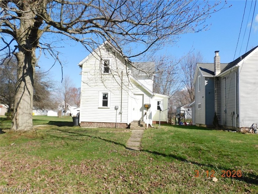 three-bedroom home tucked into a quiet residential pocket of - Beach Home for sale in Conneaut, Ohio on Beachhouse.com
