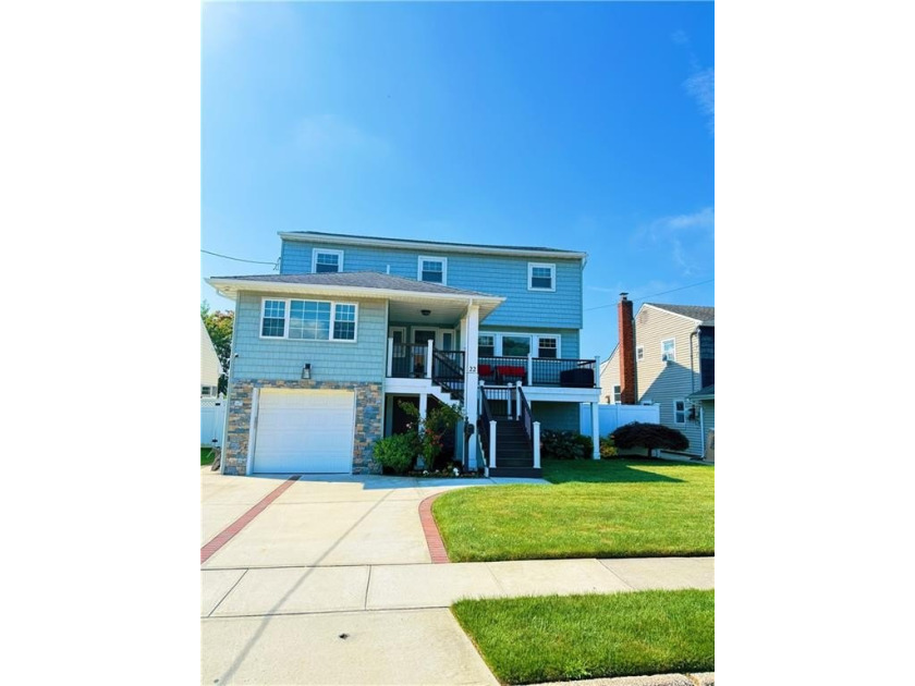 Nestled in a quaint Cul De Sac, this split level elevated 4 BR - Beach Home for sale in Freeport, New York on Beachhouse.com
