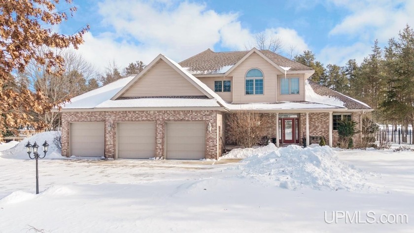 This executive-style home is perfectly positioned on the #2 - Beach Home for sale in Gladstone, Michigan on Beachhouse.com