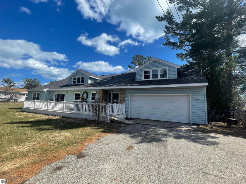 Sprawling 5 bedroom 3 bath home situated on a deep waterfront - Beach Home for sale in Oscoda, Michigan on Beachhouse.com