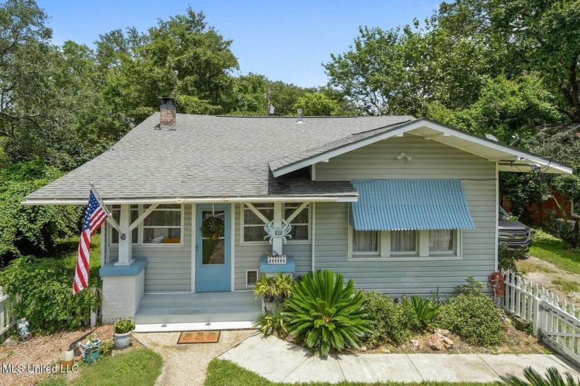 This beautiful storybook Beach Cottage offers stunning original - Beach Home for sale in Gulfport, Mississippi on Beachhouse.com