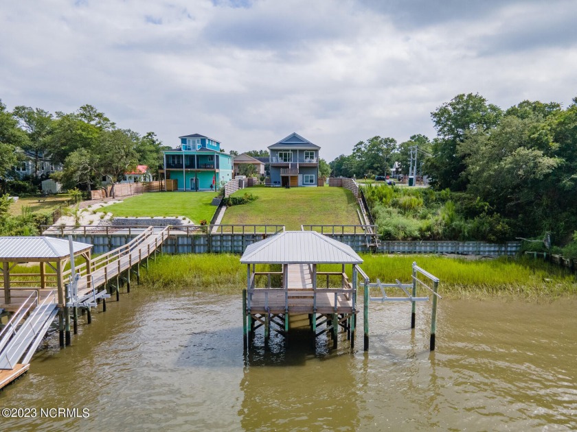 Welcome to this stunning 3 bedroom waterfront home perched high - Beach Home for sale in Oak Island, North Carolina on Beachhouse.com