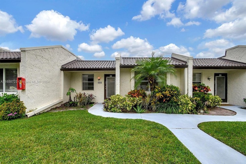 Located in the vibrant 55+ community of Golden Lakes Village - Beach Home for sale in West Palm Beach, Florida on Beachhouse.com