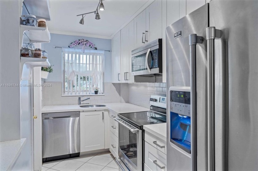 Step into this beautifully remodeled 1-bedroom, 1-bathroom condo - Beach Condo for sale in Hallandale Beach, Florida on Beachhouse.com