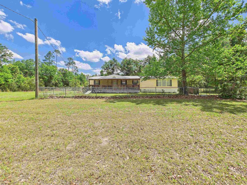 This 3 bedroom, 2 bath home sits on 5 beautiful acres in a - Beach Home for sale in Perry, Florida on Beachhouse.com