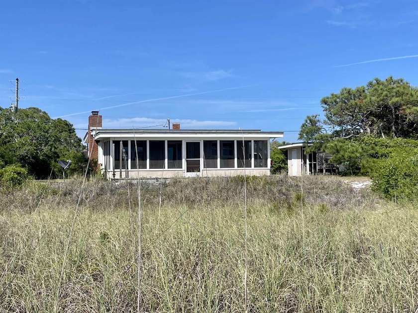 Experience coastal living at its finest with this charming - Beach Home for sale in Alligator Point, Florida on Beachhouse.com
