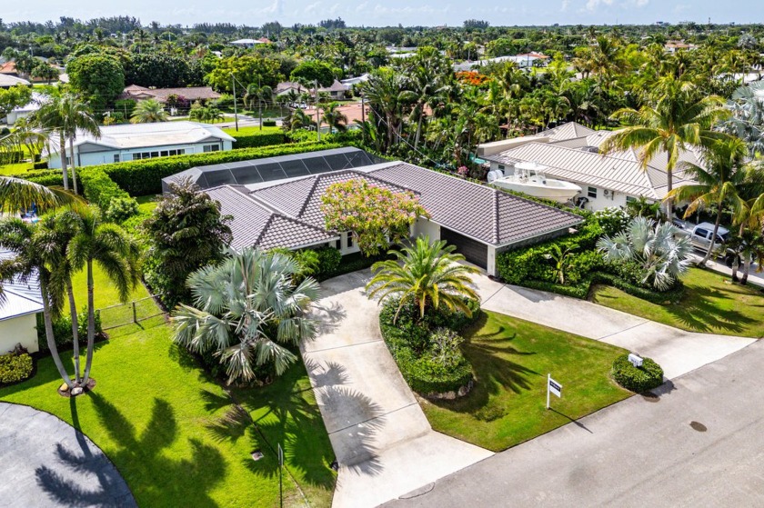 Welcome to 7652 Palm Road -- a meticulously maintained 4-bedroom - Beach Home for sale in Lake Clarke Shores, Florida on Beachhouse.com