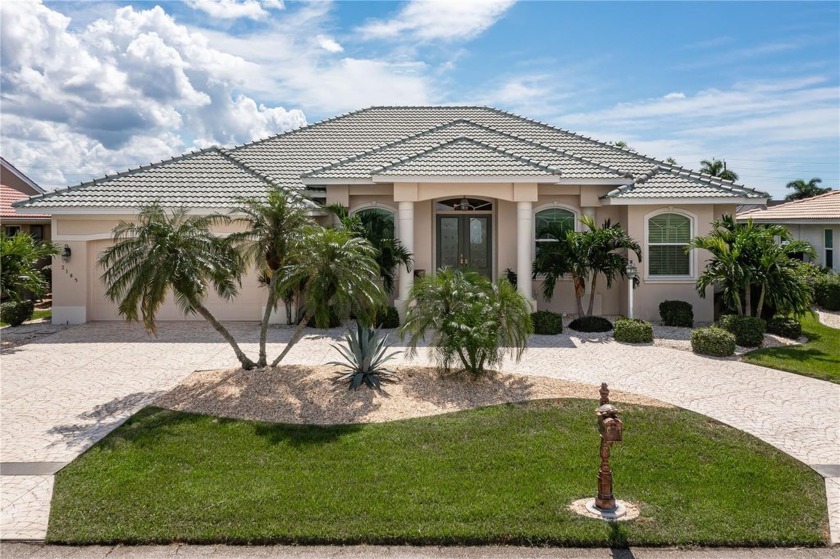 CUSTOM WATERFRONT HOME IN PGI W/**NEW ROOF**, QUICK BOATING - Beach Home for sale in Punta Gorda, Florida on Beachhouse.com