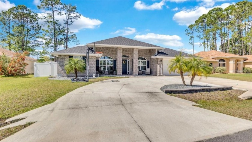 Welcome to this stunning BRICK HOME built in 2019. Step into a - Beach Home for sale in Palm Coast, Florida on Beachhouse.com